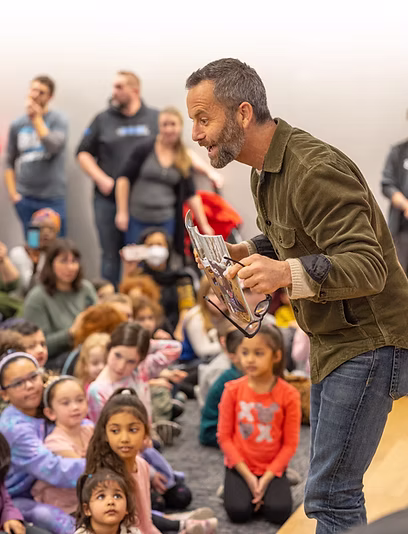 Kirk Cameron reading to families at a Brave Story Hour in Scarsdale, NY